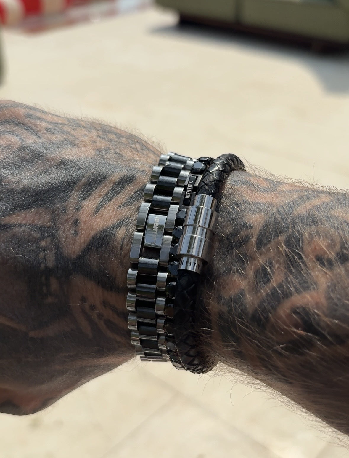 Executive Two-Tone Bracelet worn stacked with the Ethos leather bracelet